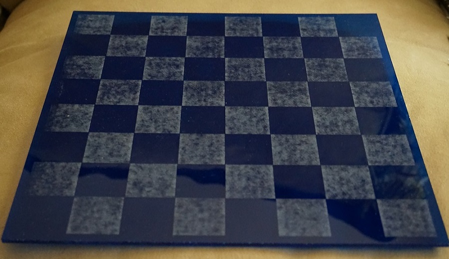 Laser-engraved chess board with marbled squares.