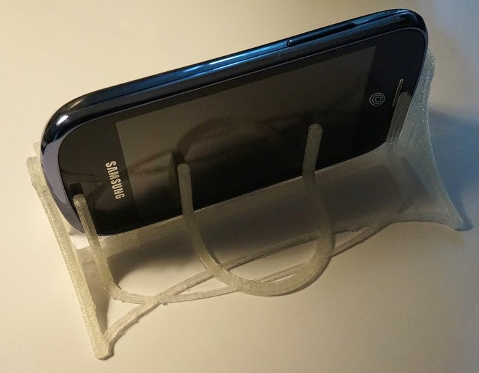 The printed phone holder, holding a phone